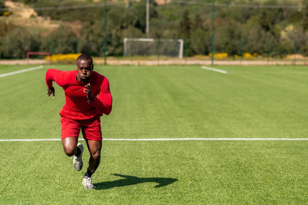 Footballer sprinting during training