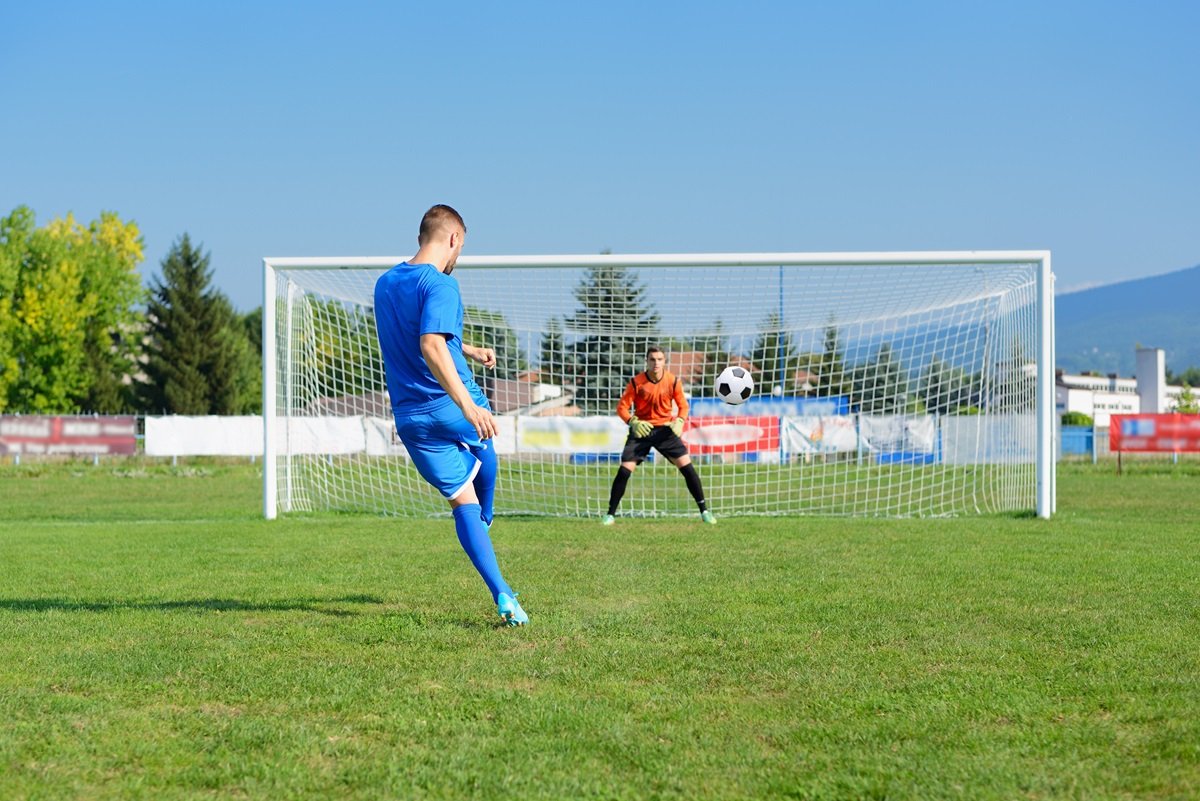 Footballer using an agility ladder