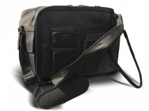 A black coach's bag rests on a surface. It features multiple zippered compartments and a long adjustable strap.